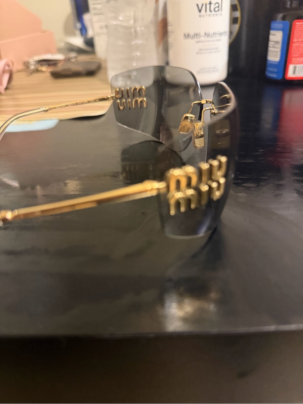 Authentic Pair Of Miu Miu Gold-Tone Rimless Sunglasses with Gray Lenses